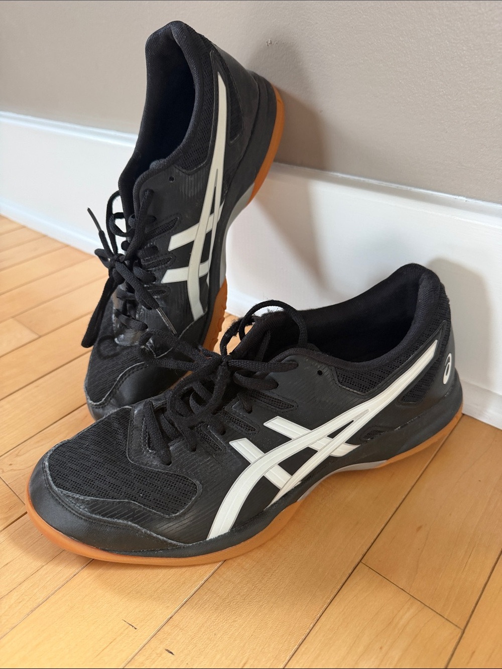 Asics women’s Black and White Athletic Court Shoes with Gum Outsole. Size 9
